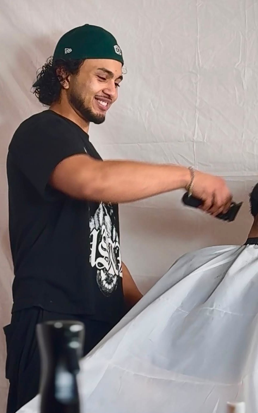 UV smiling mid-cut in the studio